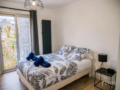 Un ou plusieurs lits dans un hébergement de l'établissement L'appartement de jeanne
