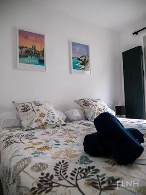 Un ou plusieurs lits dans un hébergement de l'établissement L'appartement de jeanne
