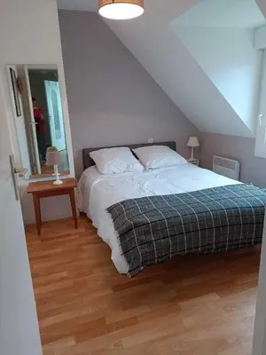 Un ou plusieurs lits dans un hébergement de l'établissement La maison des vacances