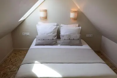 Un ou plusieurs lits dans un hébergement de l'établissement Ti Gwaskell, maison proche de Quimper