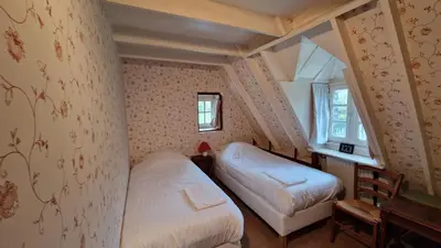 Un ou plusieurs lits dans un hébergement de l'établissement La Grange du Moulin de Lossulien