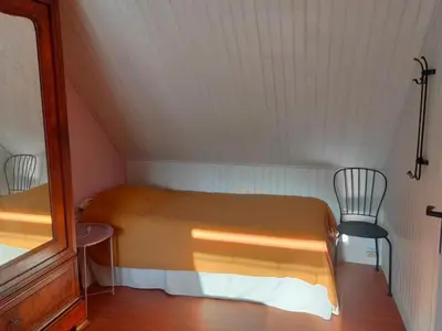 Un ou plusieurs lits dans un hébergement de l'établissement Avel Glaz - Chambres d'hôtes pour randonneurs et cyclistes