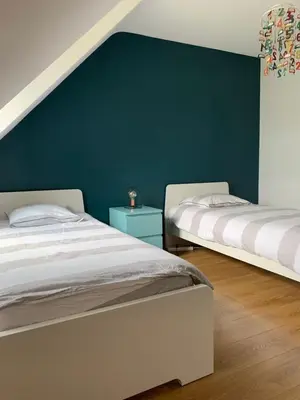 Un ou plusieurs lits dans un hébergement de l'établissement Villa des Roseaux