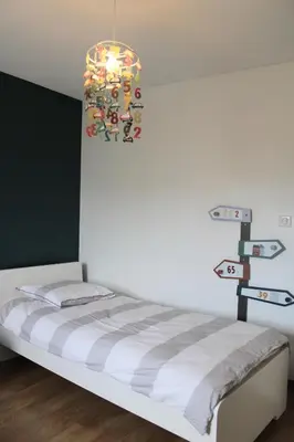 Un ou plusieurs lits dans un hébergement de l'établissement Villa des Roseaux