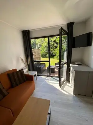 Coin salon dans l'établissement Joli T2 Résidence du Golf avec terrasse